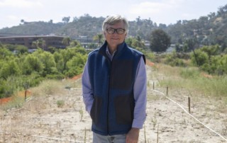 CEO and President of the San Diego River Park Foundation, Rob Hutsel, stands along the San Diego River bed near Mission Valley. (Thom Vollenweider)