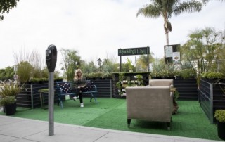 Kelly Lannom, interim executive director for Chula Vista’s Third Avenue Village Association makes a phone call in a newly transformed parklet in Chula Vista's Third Avenue Village