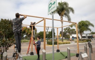 From left, Andrew Hatch Casey Jacobs and Brittany Borden help transform parking spaces into parklets in Chula Vista